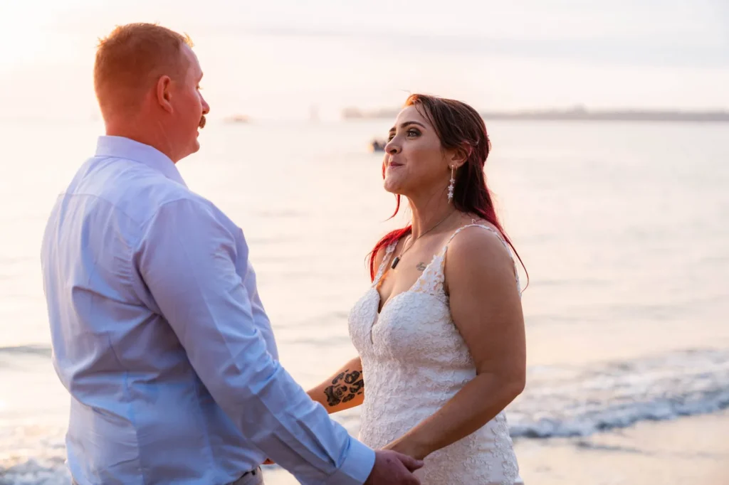 Bride and groom on the beach at sunset, wedding by Kalf Productions